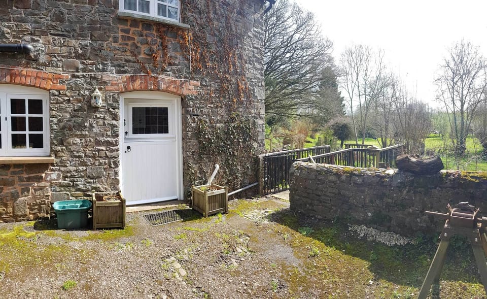 Cottage door and courtyard overlooking the grounds