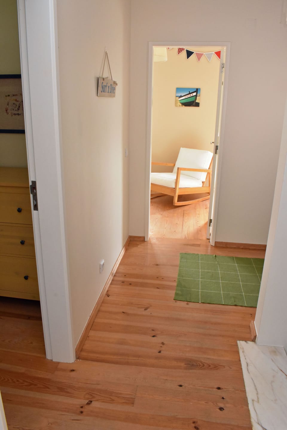 First floor hallway. Children's bedroom ahead, bunk bed room to the left.
