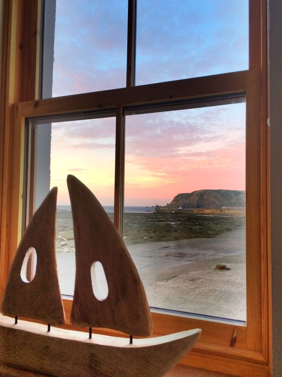 Low tide at the harbour entrance from inside Gannet cottage.