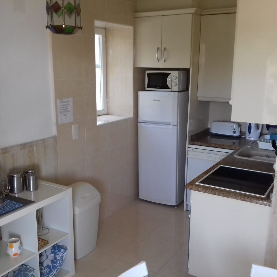 Kitchen off the main room with dishwasher, hob microwave. Air con throughout.