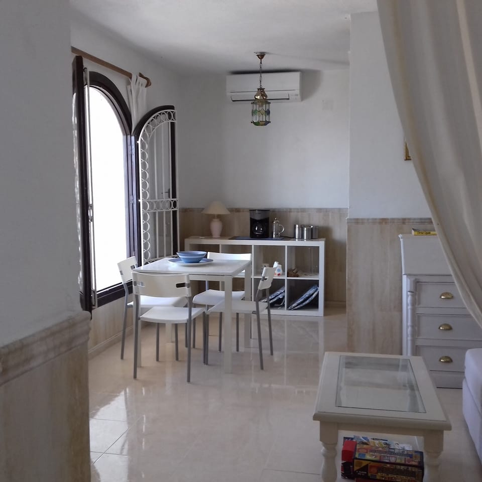 The small separate casita under the main house has its own front door. open plan