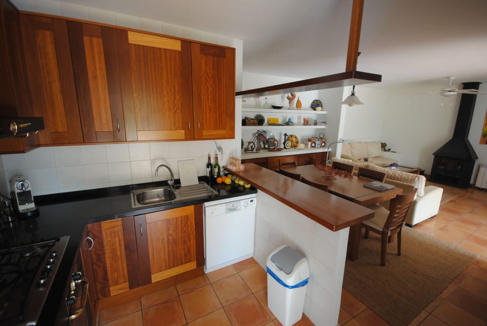Kitchen leads to dining area and pool