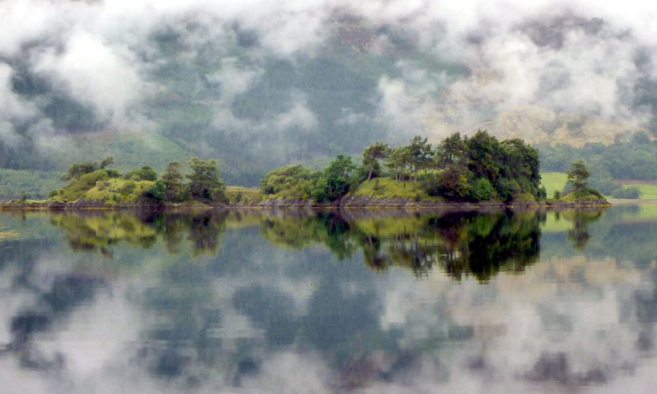 An atmospheric view of the ''Burial Isle" on Loch Leven. 