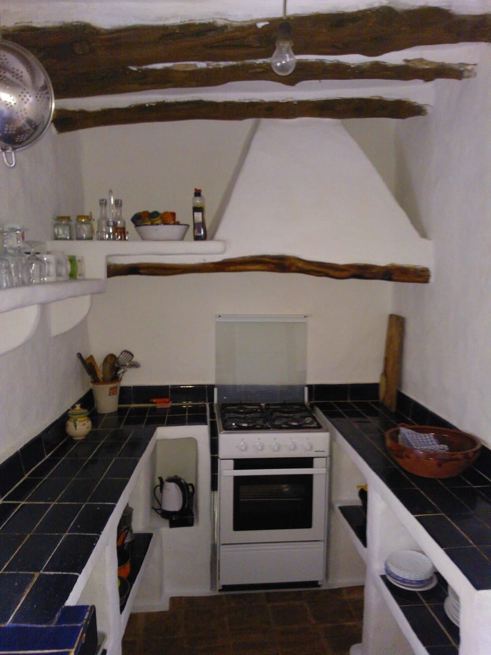 Kitchen has gas cooker and oven, electric fridge and microwave.