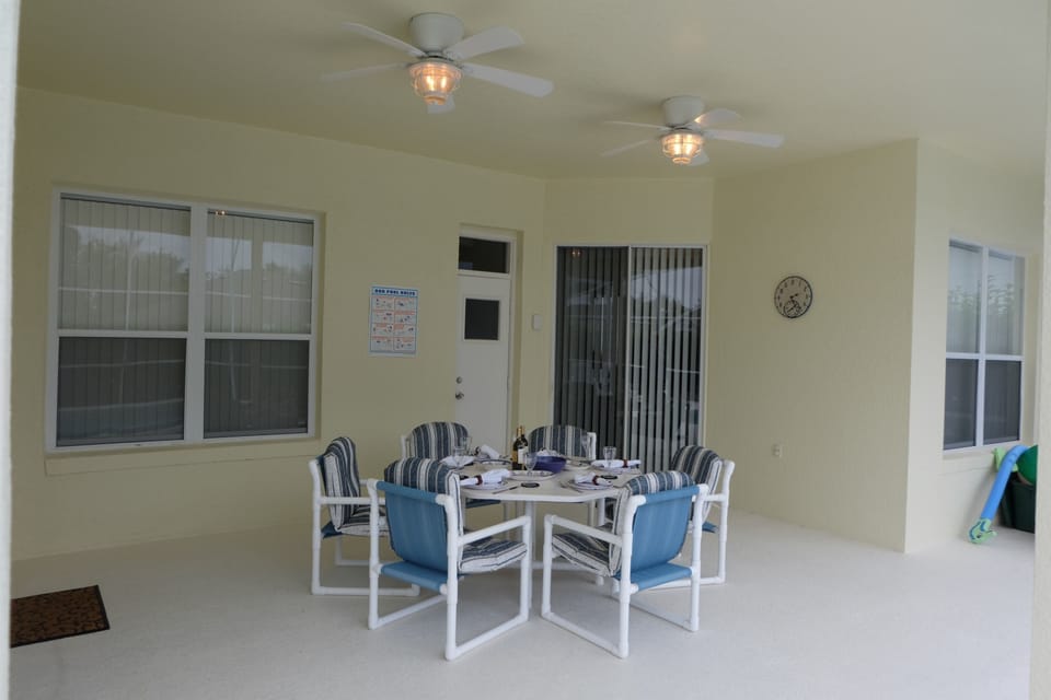 "Lanai" showing the  ceiling fans and lights for outdoor dining.
