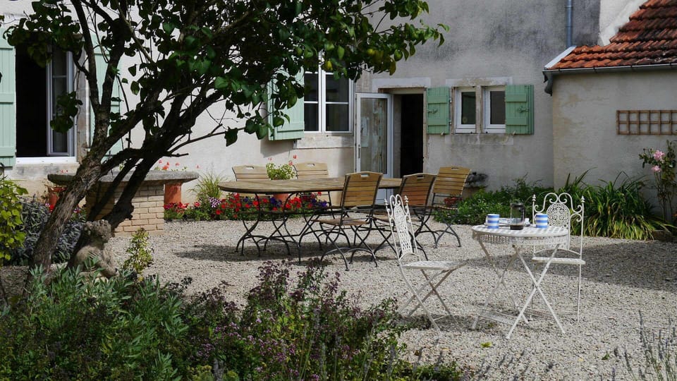 sunny sheltered courtyard , lovely for dining al fresco