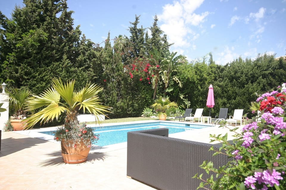 sofas, sunbeds by the pool area, totally private