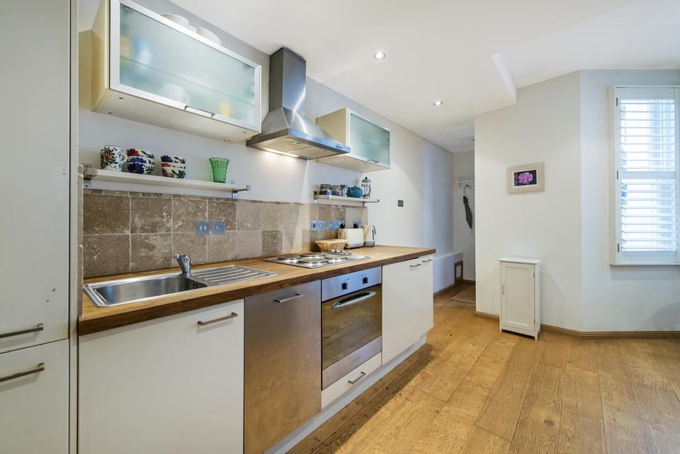 Kitchen with hob, extractor, oven, dishwasher, washing machine & fridge freezer,