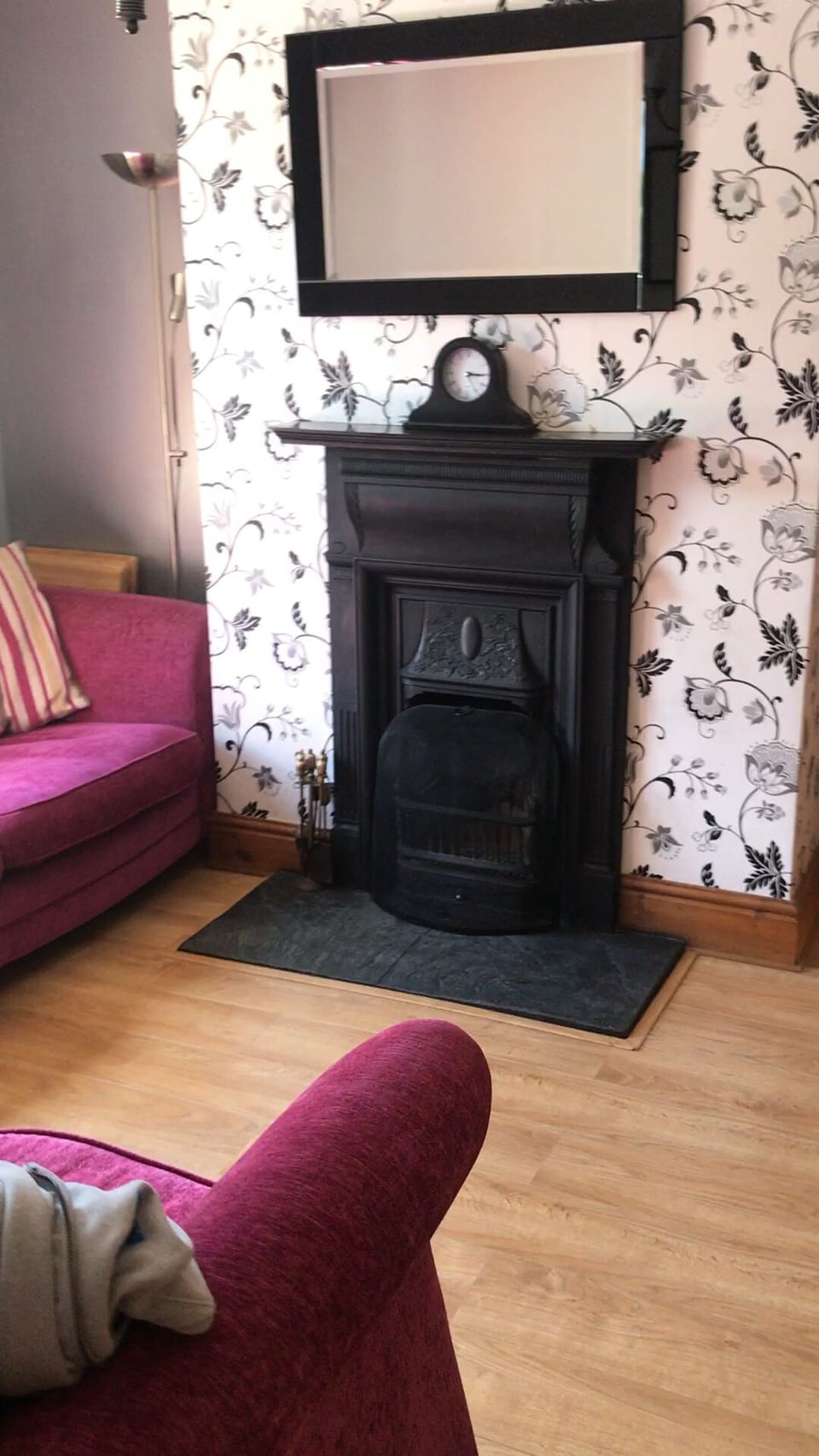 A period real fire is the focal point of the cosy snug room.