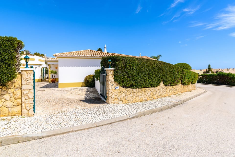Gated driveway into the villa