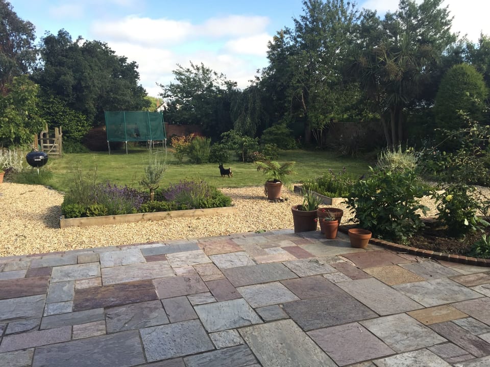 Spacious fully enclosed garden with terrace area