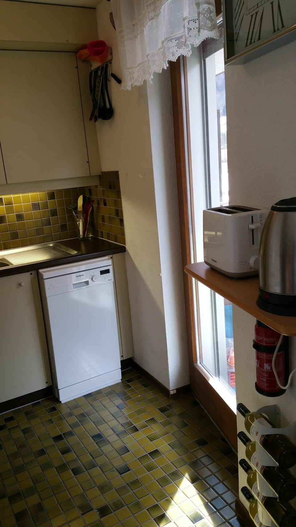 Dishwasher, door to balcony, wine rack (wine not included)