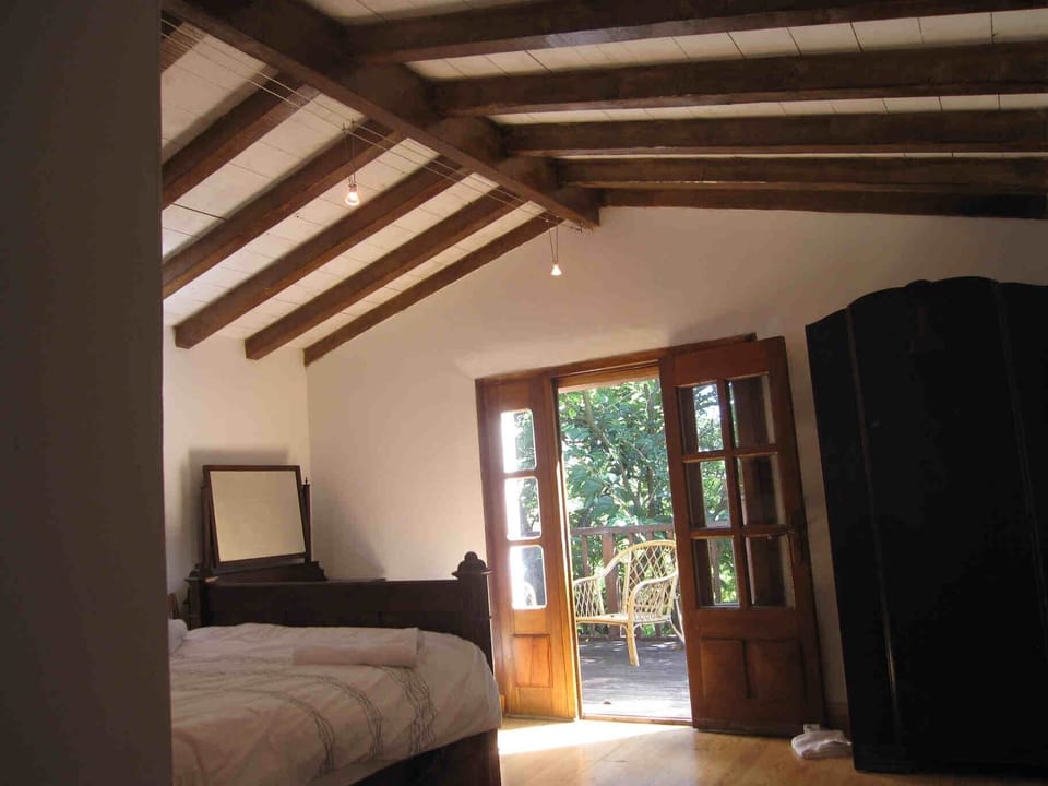 upstairs bedroom leading to balcony