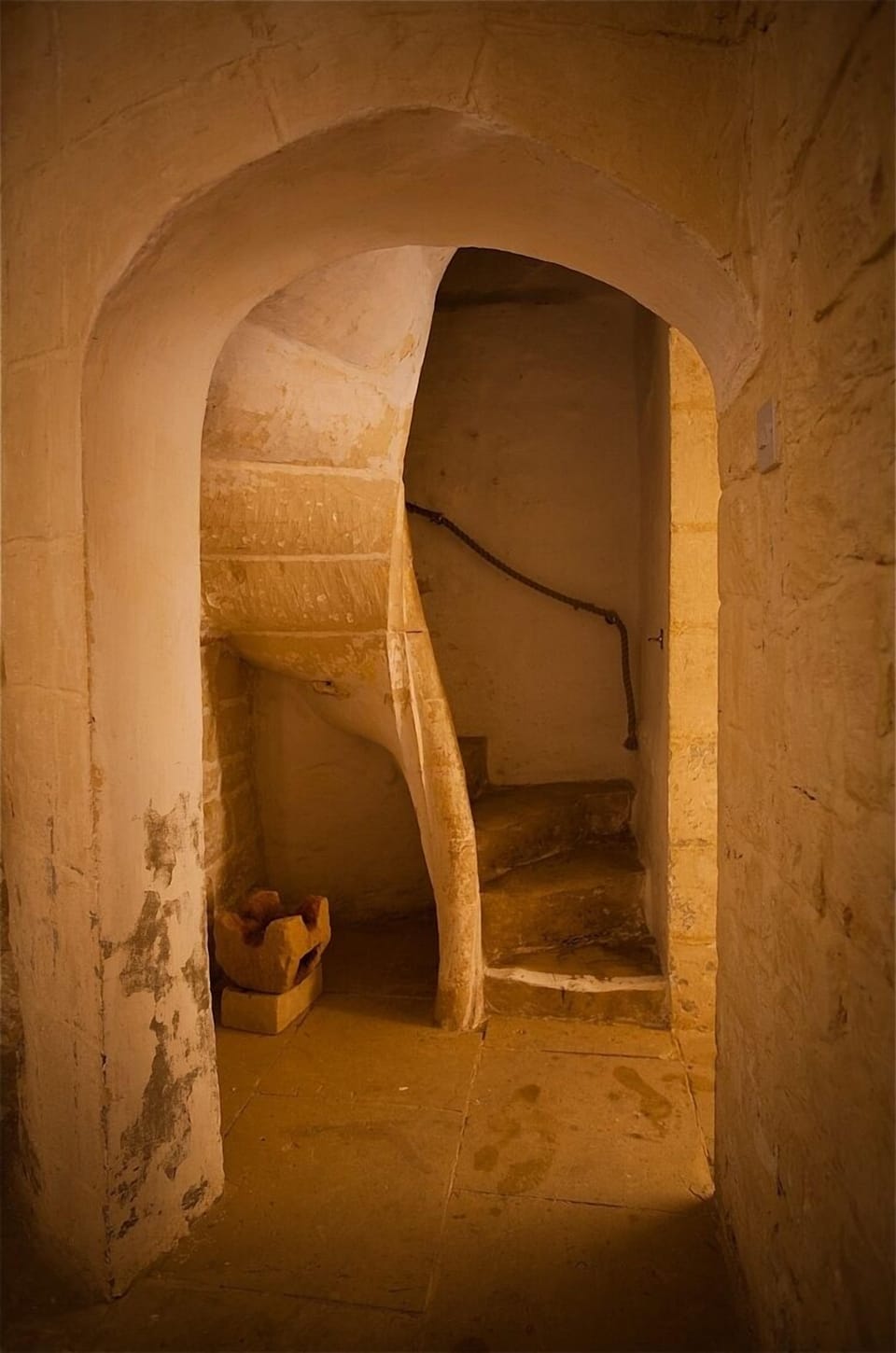 Spiral staircase in house. There are other stairs