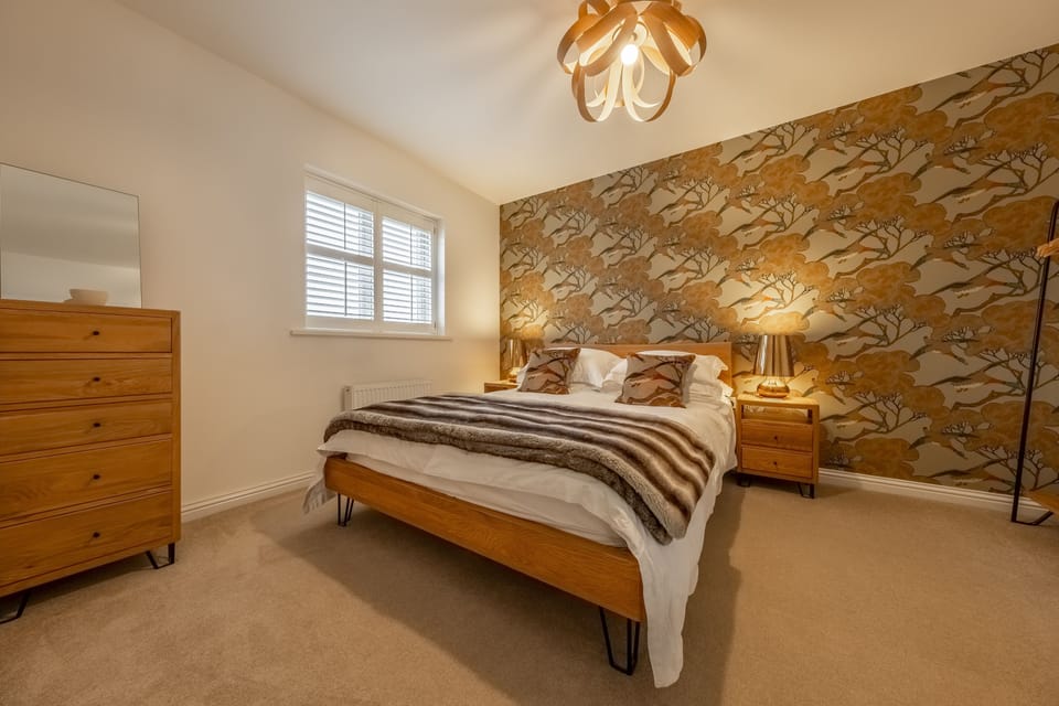 First floor: Master bedroom with a king-size bed