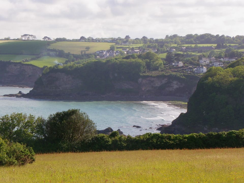 Duporth Beach from Carlyon Bay. The apartment is behind the near headland