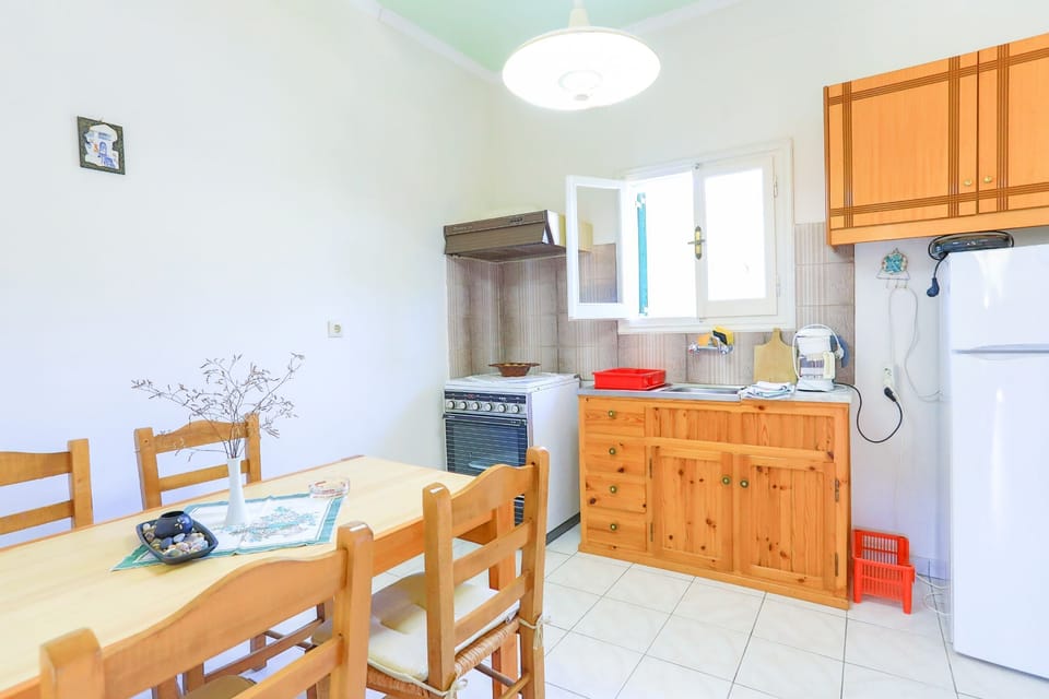 Kitchen with fridge cooker and table