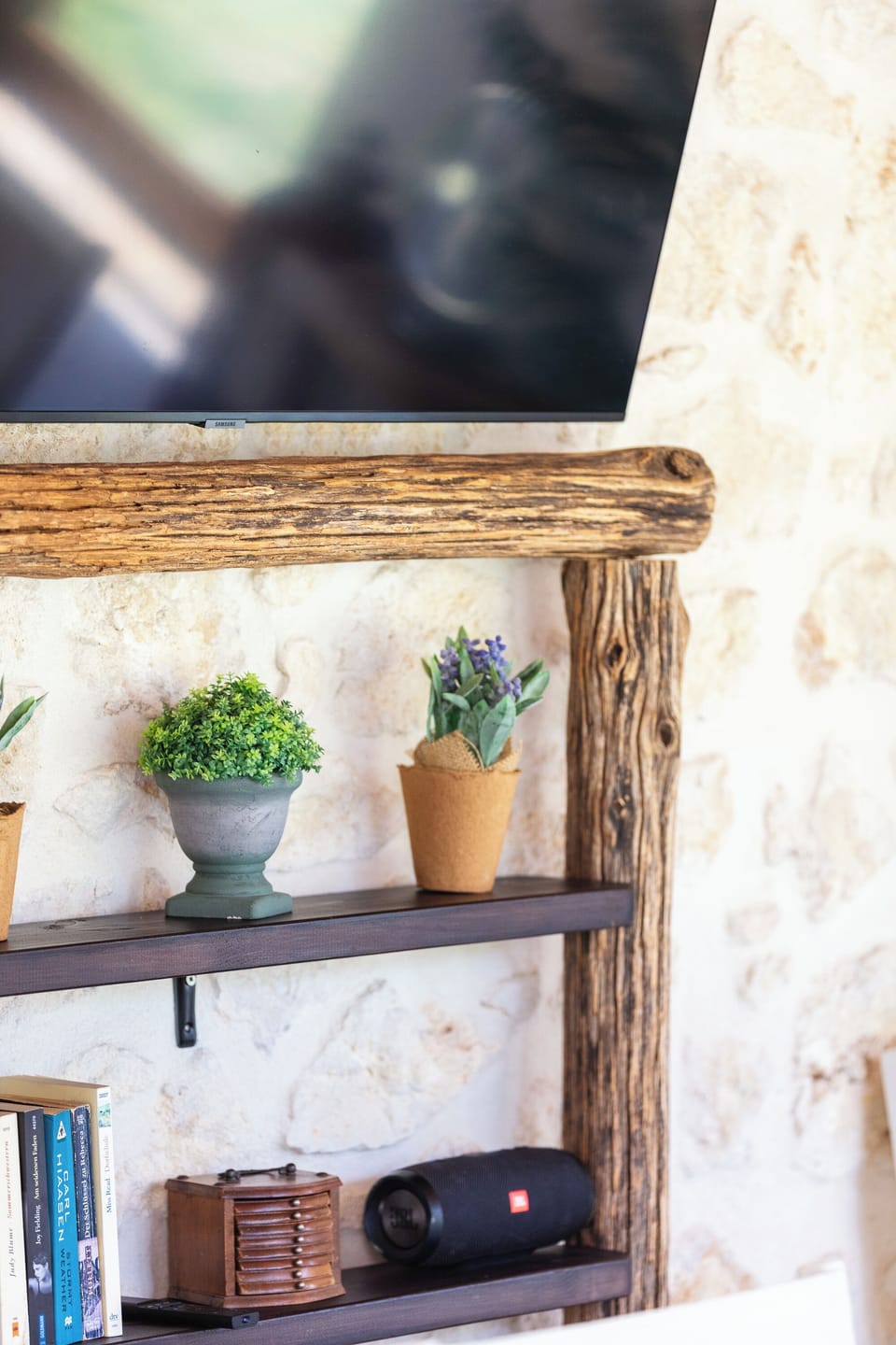 Outdoor wooden design with a bluetooth portable speaker.