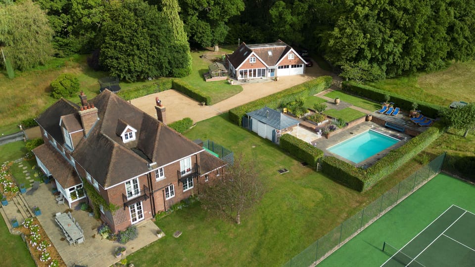 Side aerial shot with Cottage in rear