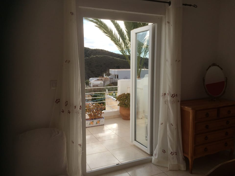 Patio doors from bedroom 1 out to balcony