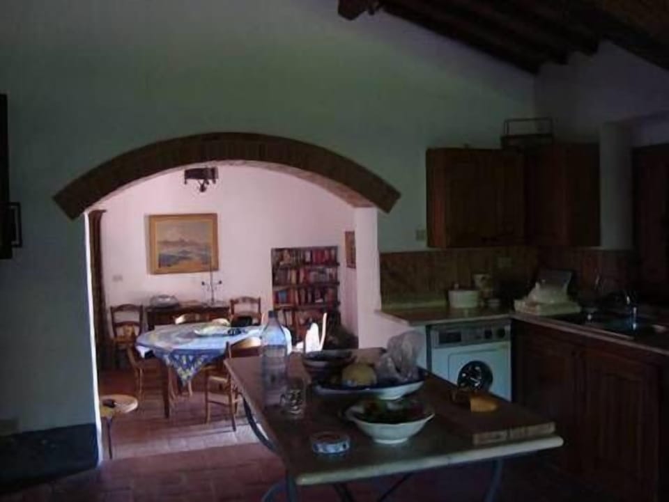 The dining room from Kitchen   Sun coming in through open door to garden