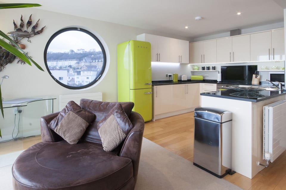 Largest kitchen within Horizon View with unique porthole overlooking the village