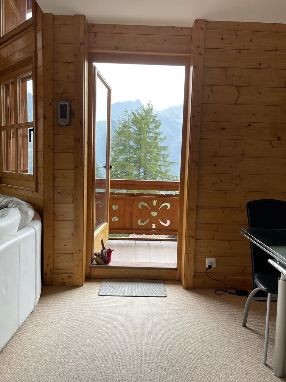 Looking through living area to front balcony.