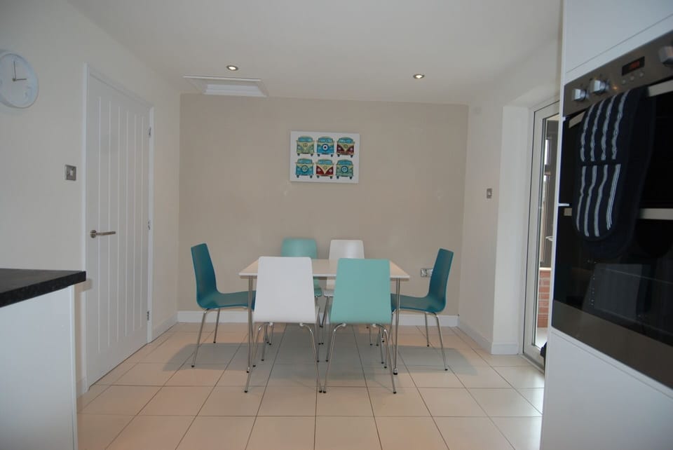 Modern dining area and patio doors to conservatory
