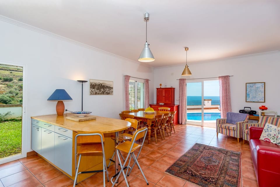 Kitchen dinner with access to pool terrace