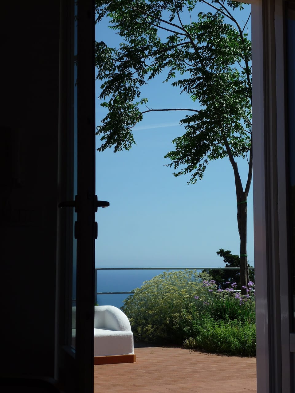 Looking out of lounge doors onto terrace