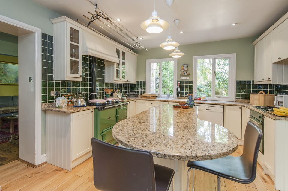 The kitchen has an Aga plus separate oven and hob.