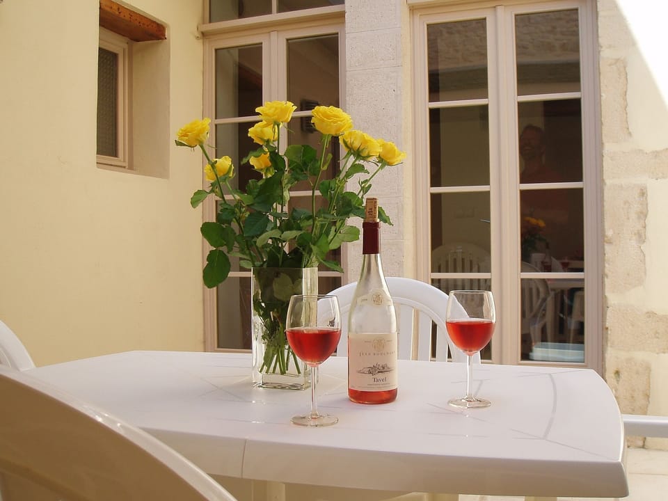 Internal courtyard with outdoor table and chairs.