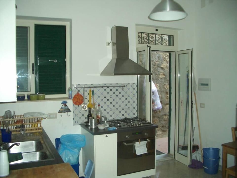 the kitchen with a second entrance from the terrace