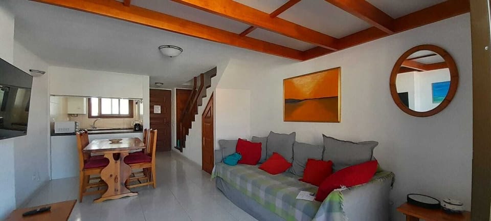 Ceiling of living area has oak beams. This photo taken from balcony door.