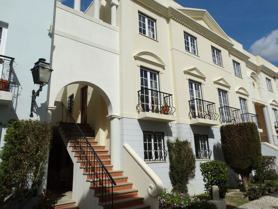 Front of apartment which is located on the first and second floor.