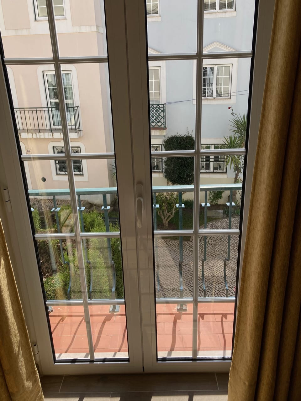 Patio doors from lounge leading out onto small balcony 