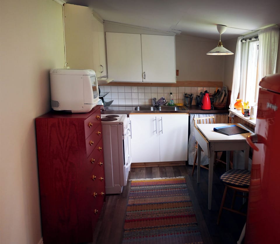 Kitchen with oven, fridge, microwave and more.