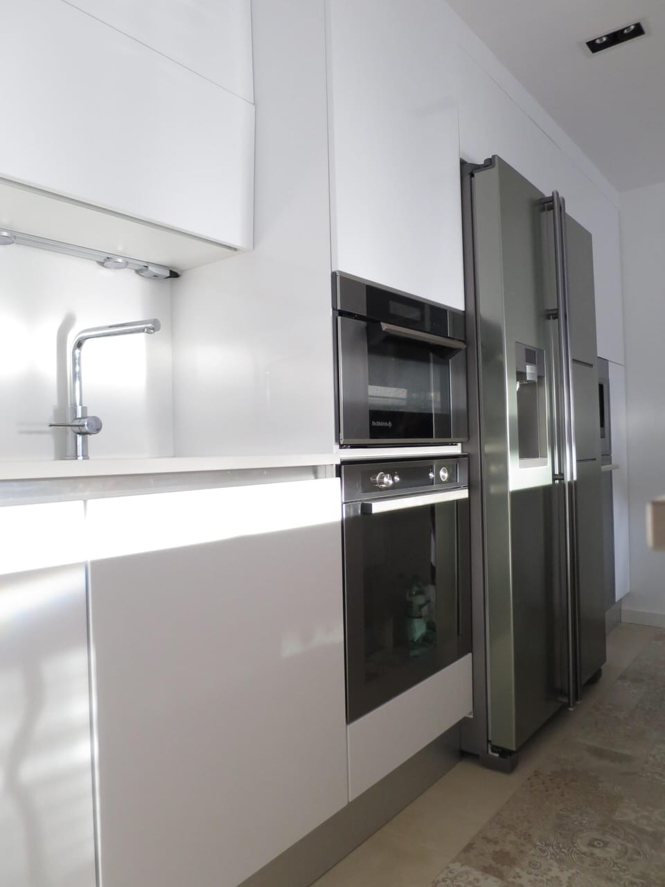microwave, oven, American fridge, integrated coffee machine, wine cave