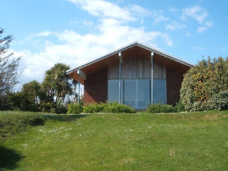 Glass sliding doors facing south  towards the sea