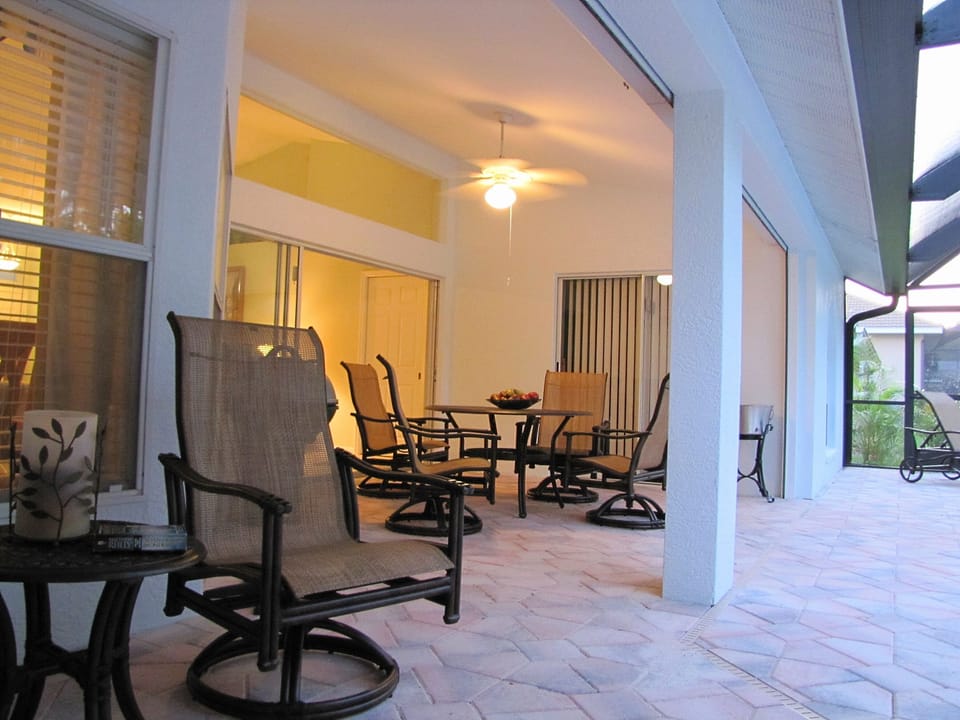 Shaded closable outdoor dining area+ light and fan
