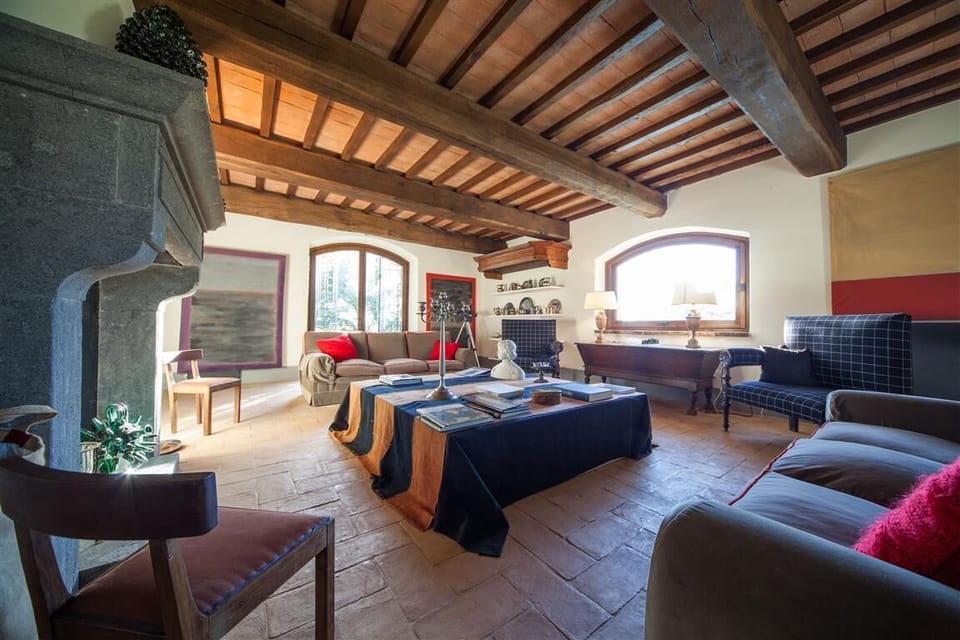 Large living room with fire place and french doors with access to the garden
