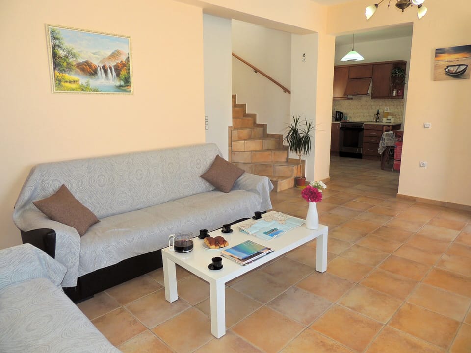 16 Nostalgia living room with opening to kitchen.