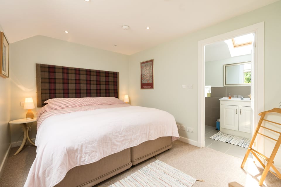Upstairs bedroom showing door to ensuite large power shower room