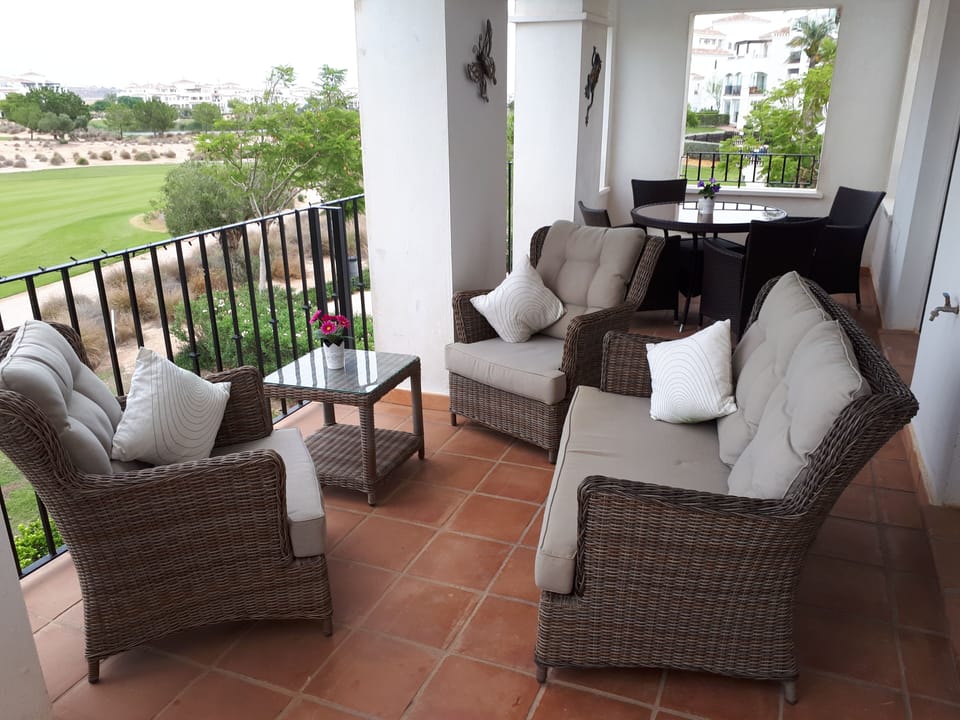 Relax on the balcony  with a glass of wine
