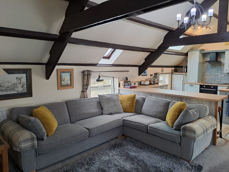 A large corner sofa sits 4 in comfort