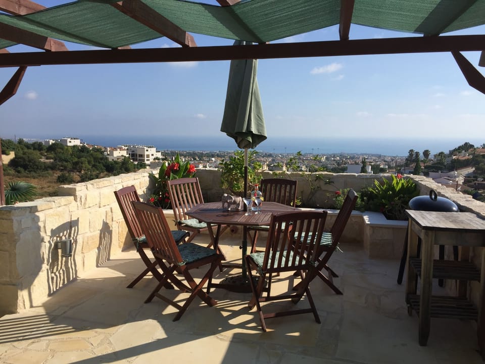 Private roof terrace and garden with views over the sea and to Pafos in the West