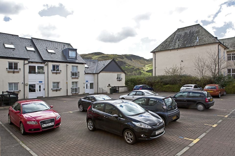 Outside of the apartment. FREE reserved parking space plus additional FREE parki