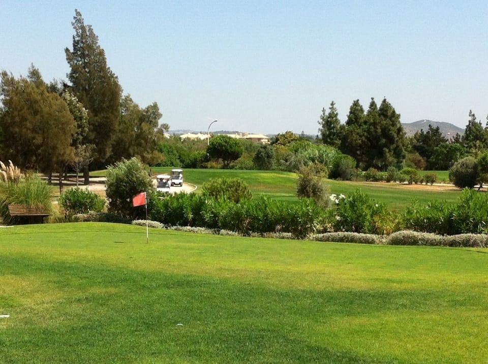 Complex's own putting green, next to the golf course 