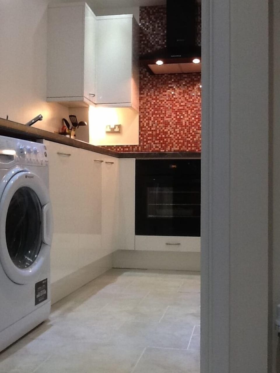 Kitchen showing washing machine and dishwasher