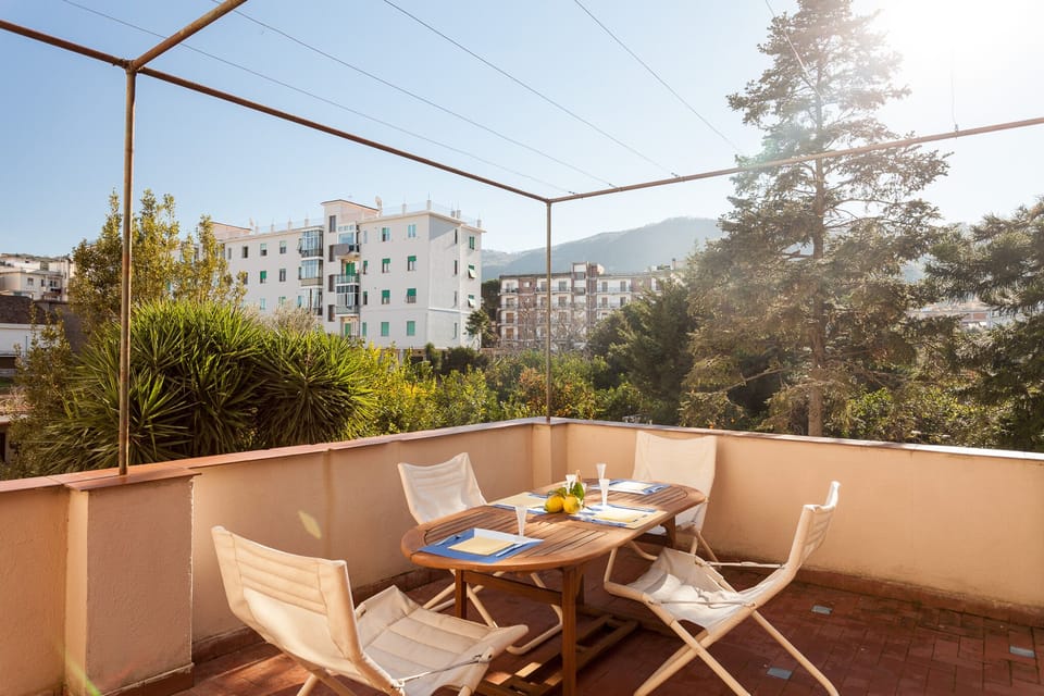 Terrace with outdoor furniture and view on internal garden. Sorrento city center